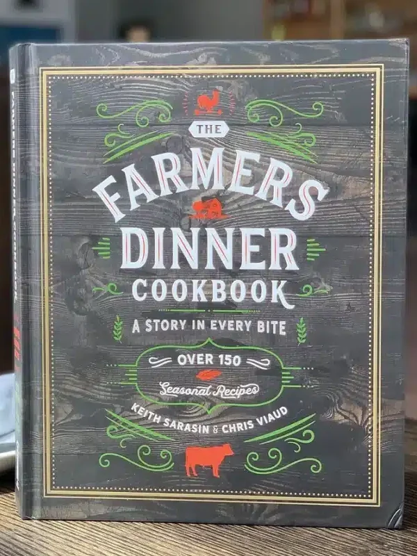 cover of the Farmer's Dinner Cookbook on a table