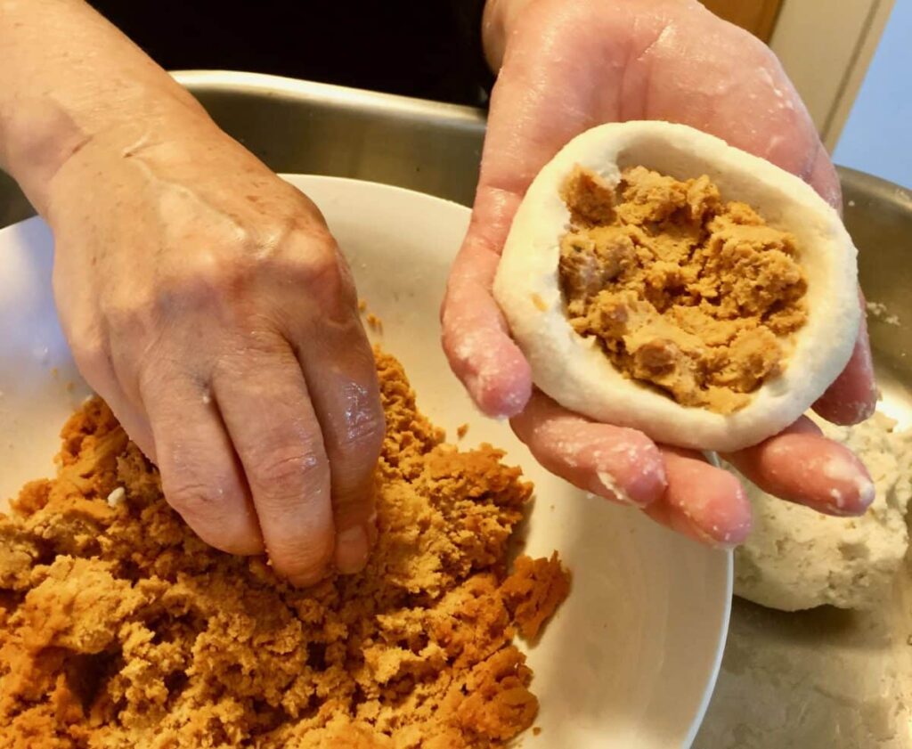 Filling the hollowed dough with chicharron