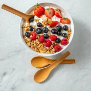 Cereal bowl with berries and an edible chocolate spoon