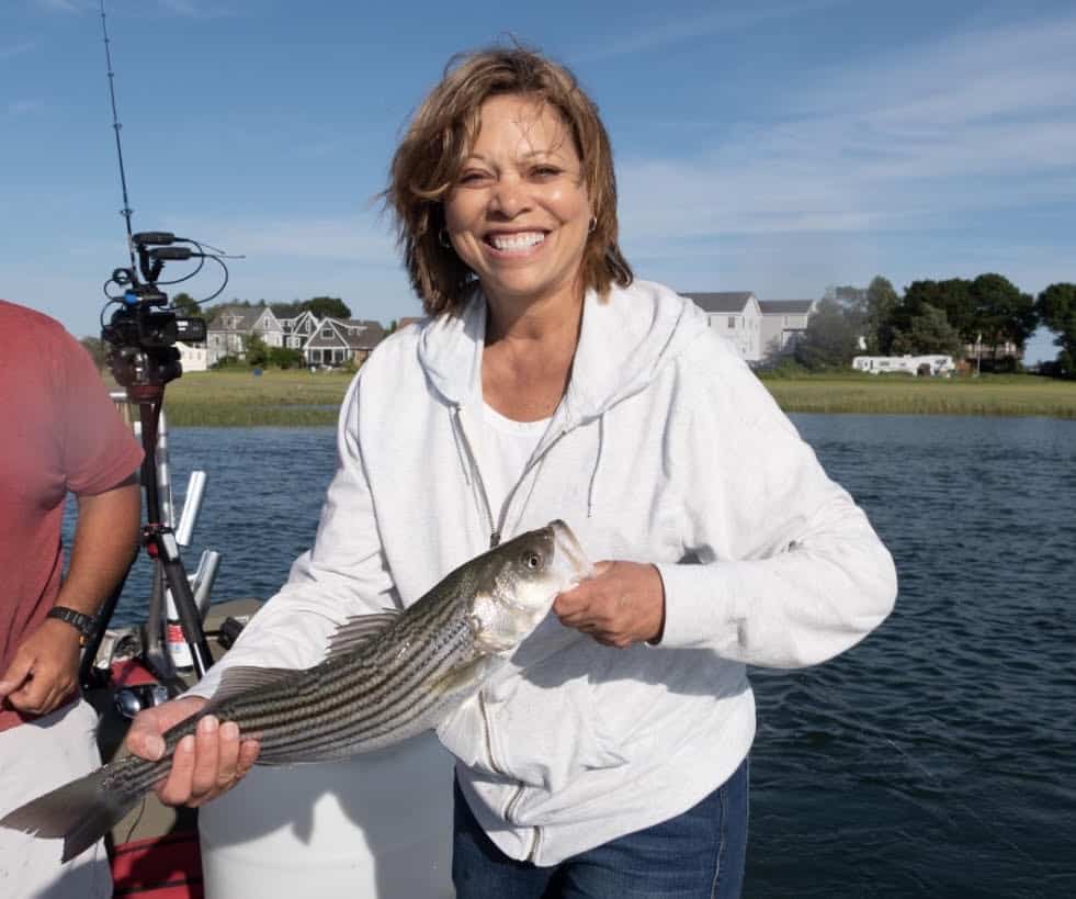 Denise with striped bass