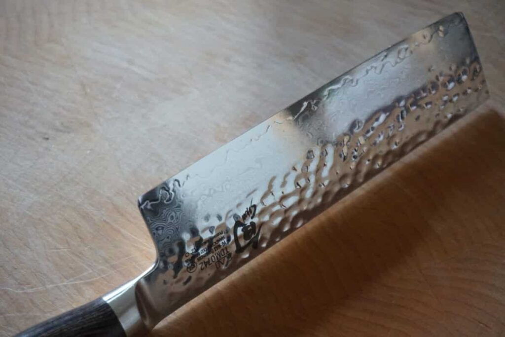 Detailed view of the blade of a Shun Premier Nakiri knife.