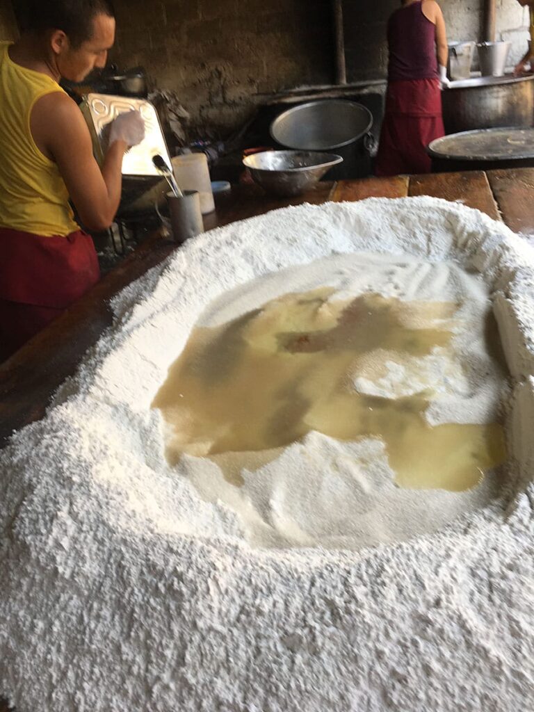 Flour mound with a center filled with boiling water.