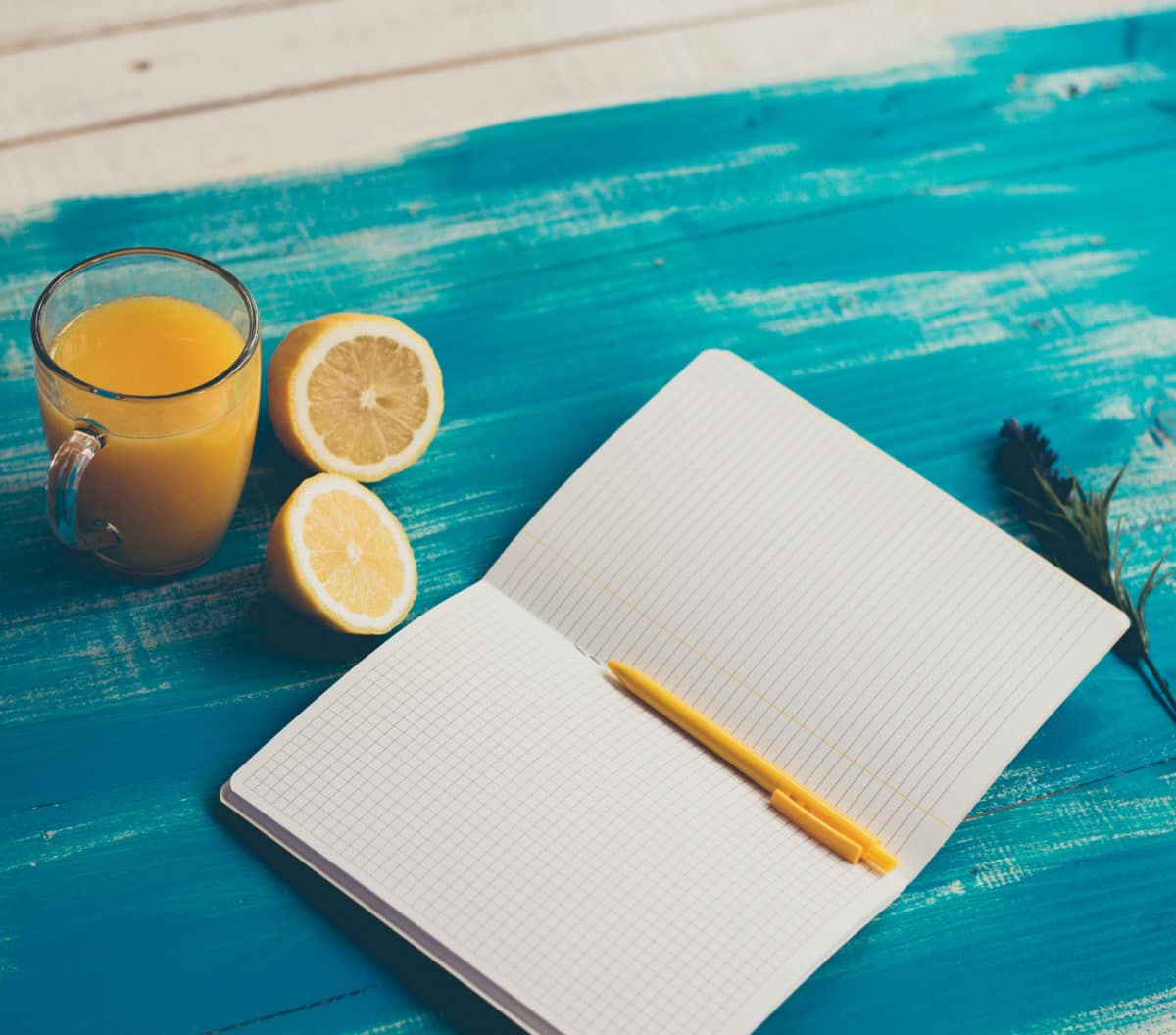 notebook, healthy food, orange juice