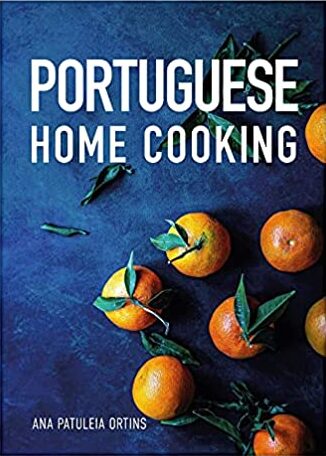 Book cover of "Portuguese Home Cooking" with oranges