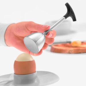 A hand using the Rosle Egg Topper on a boiled egg
